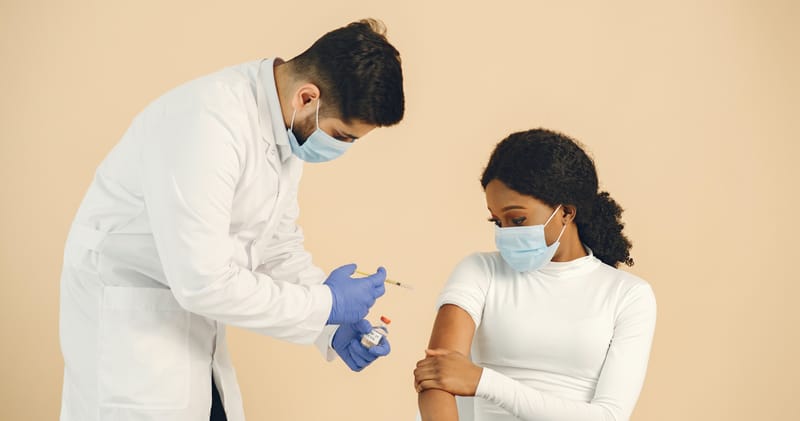 Man Vaccinating a Woman
