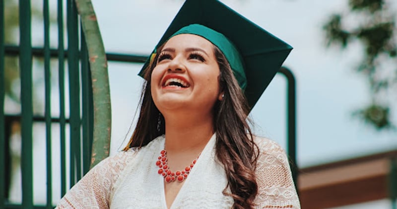 Graduate smiling with cap