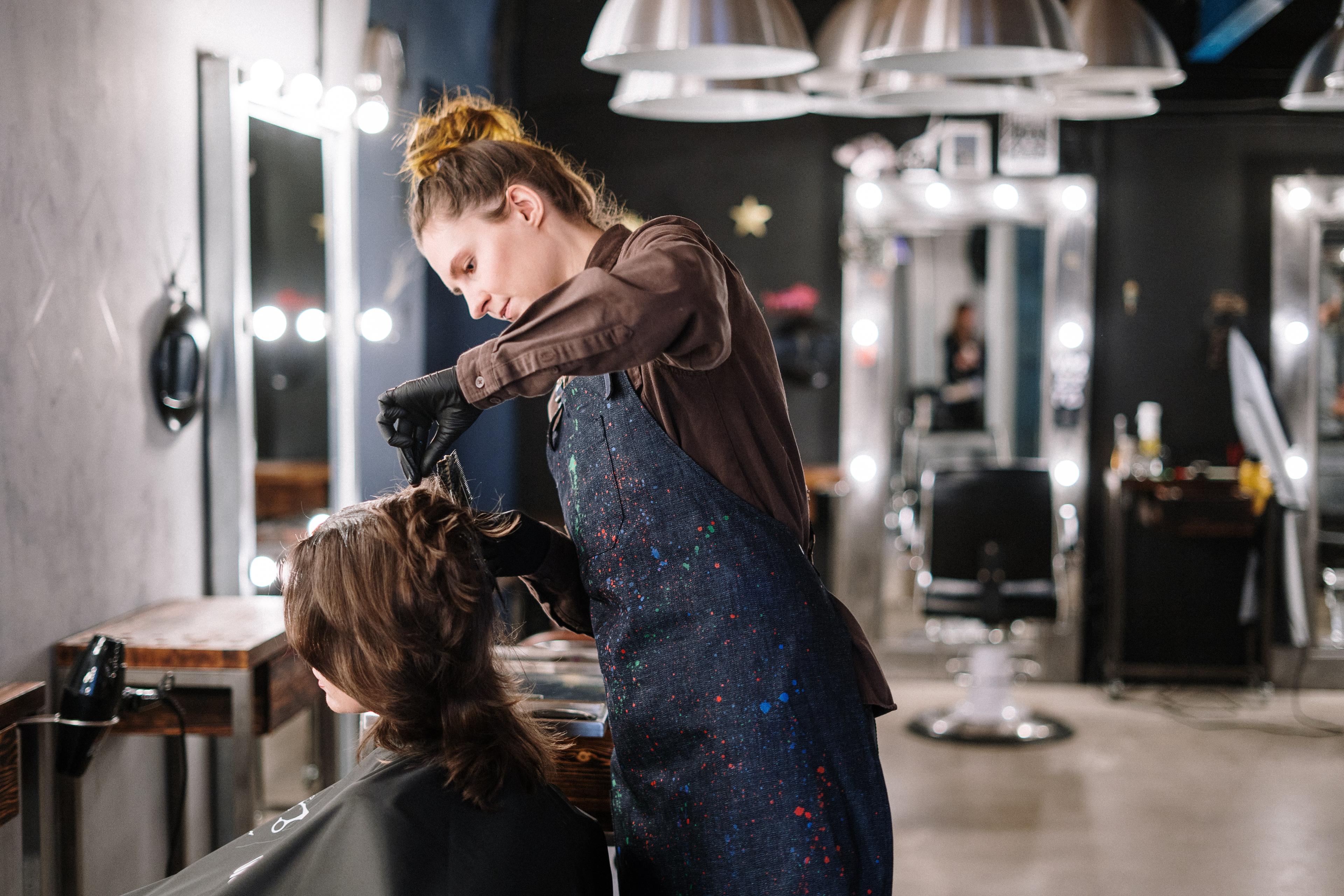hair stylist working in a salon