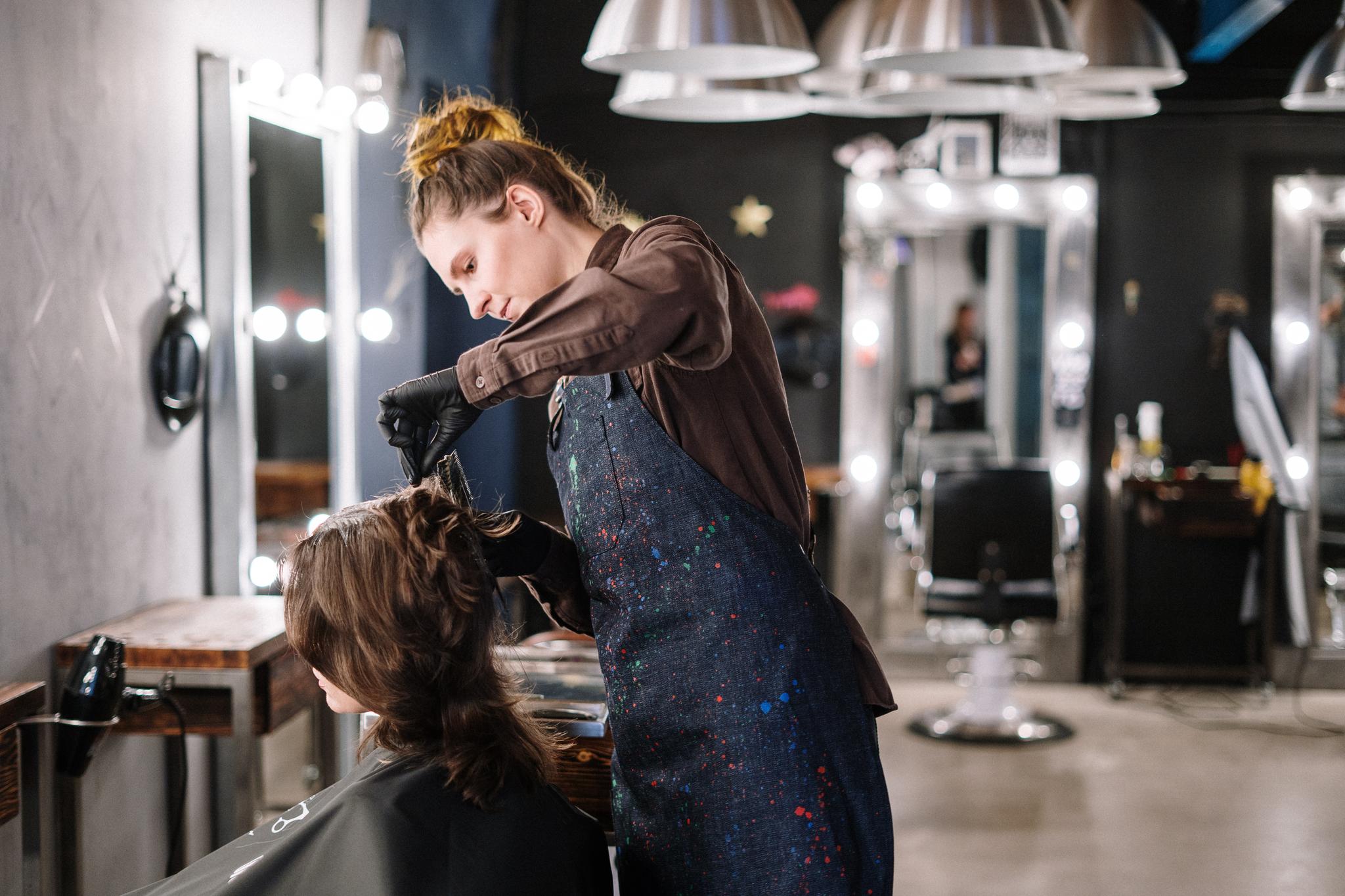 hair stylist working in a salon
