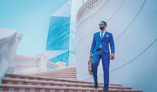 Man in suit walking down stairs
