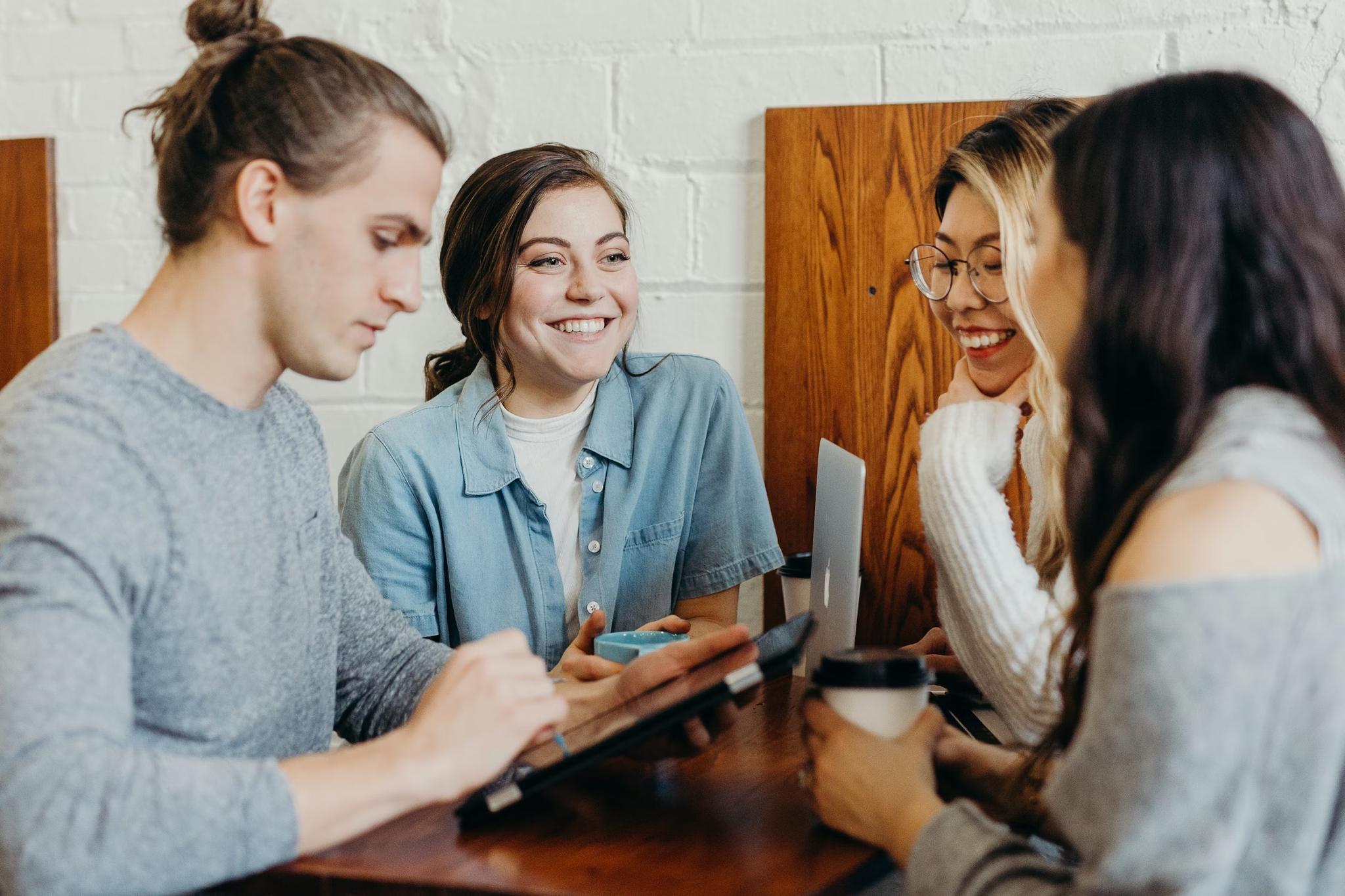 People collaborating at a café table